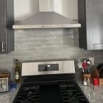 GE JVW5301BJTS 30 Wall-Mount Pyramid Chimney Hood with 350 CFM Venting System with Boost Electronic Backlit Controls Dual Halogen Cooktop Light Night