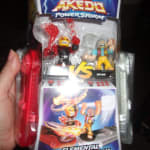 Akedo legends of akedo powerstorm versus pack 2 mini battling action figures  and 2 battle controllers epic superflare burnout versu